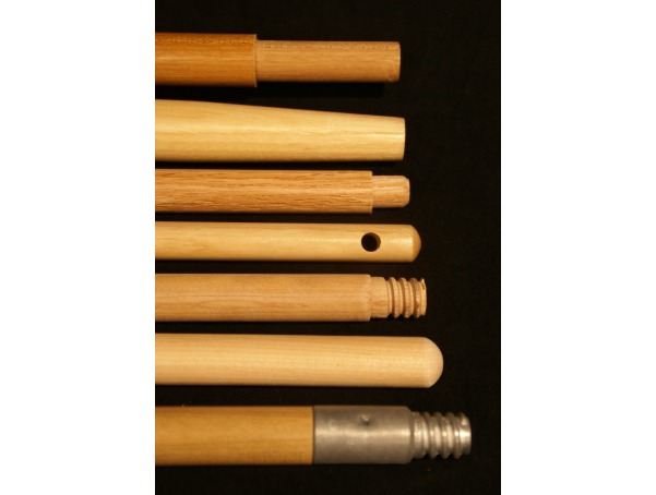 A selection of custom wood handles displaying different secondary operations, including tapering, wood threading, metal fittings, rounding, and drilled hang-up holes.